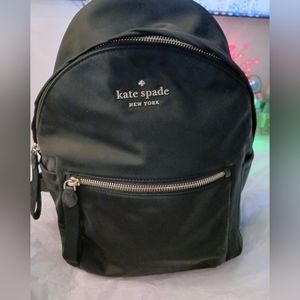 Kate Spade black vinyl backpack.